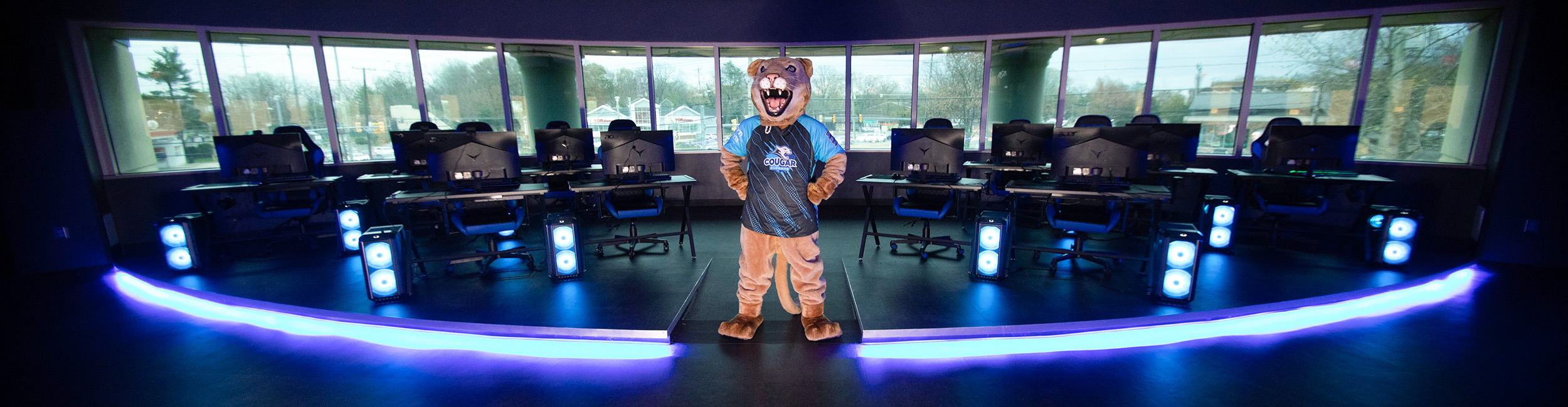 camden county college cougar standing in the esports arena